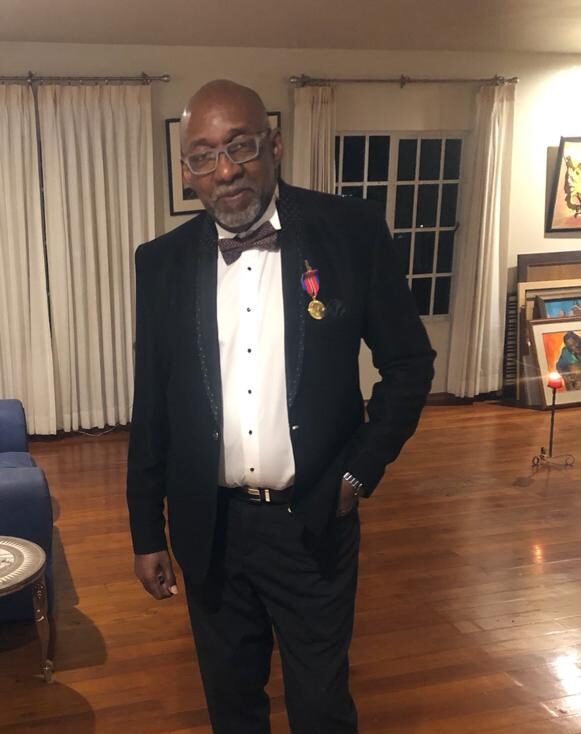 Michael Boothman with his National Award. Photo: Office of the President