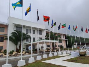 Grey skies as flags flutter in from of the Chaguaramas Convention Centre. AZP News/Prior Beharry
