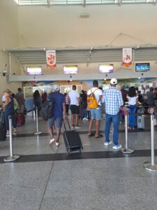 Passengers check in at the CAL counter at the Piarco International Airport  on Monday. AZP News/Prior Beharry