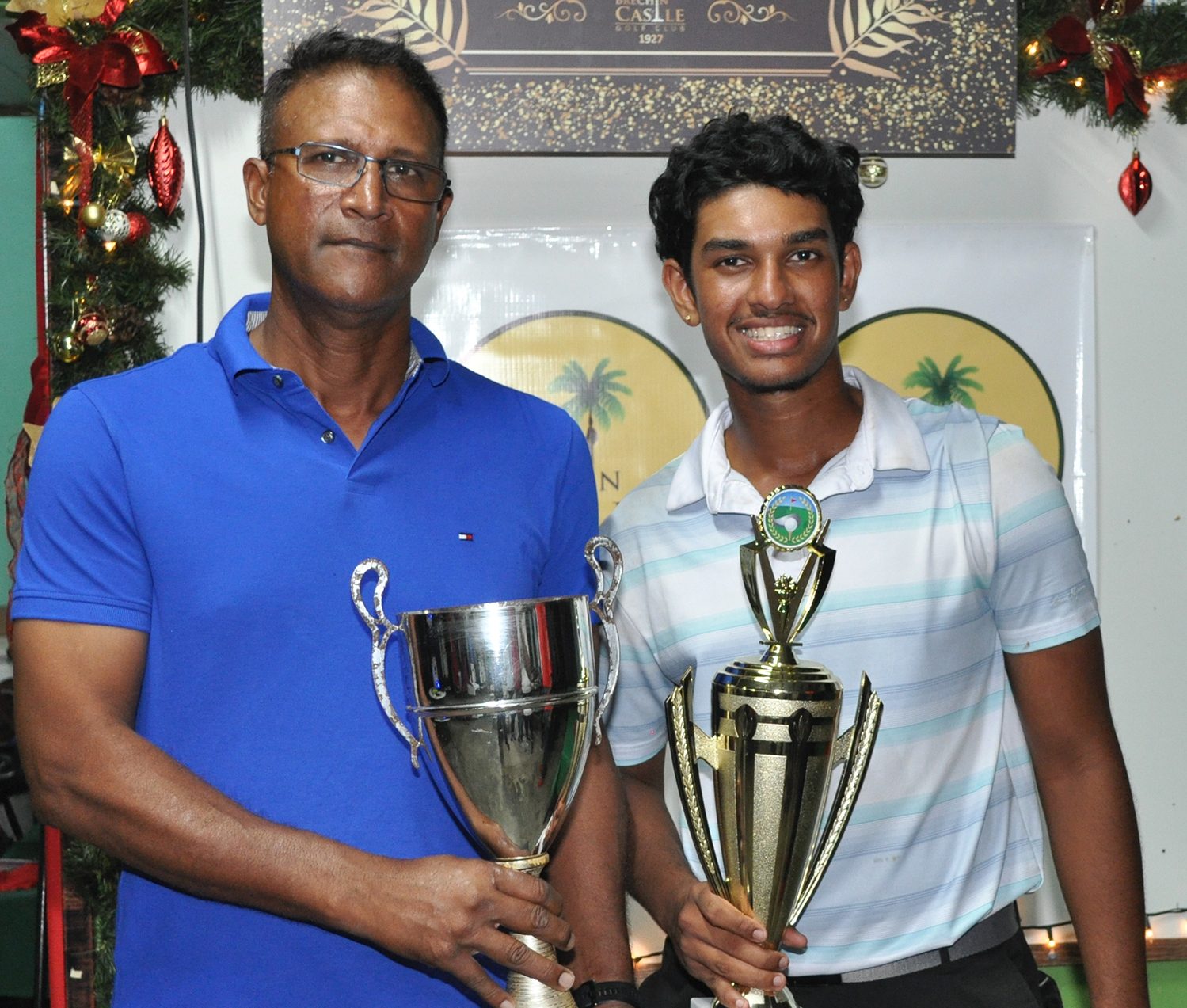 Winner of Championship Flight of the Brechin Castle Gold Course Open 2024, Jerseem Boodram, collects his trophy from BCGC’s President, Steve Jagroopsingh.