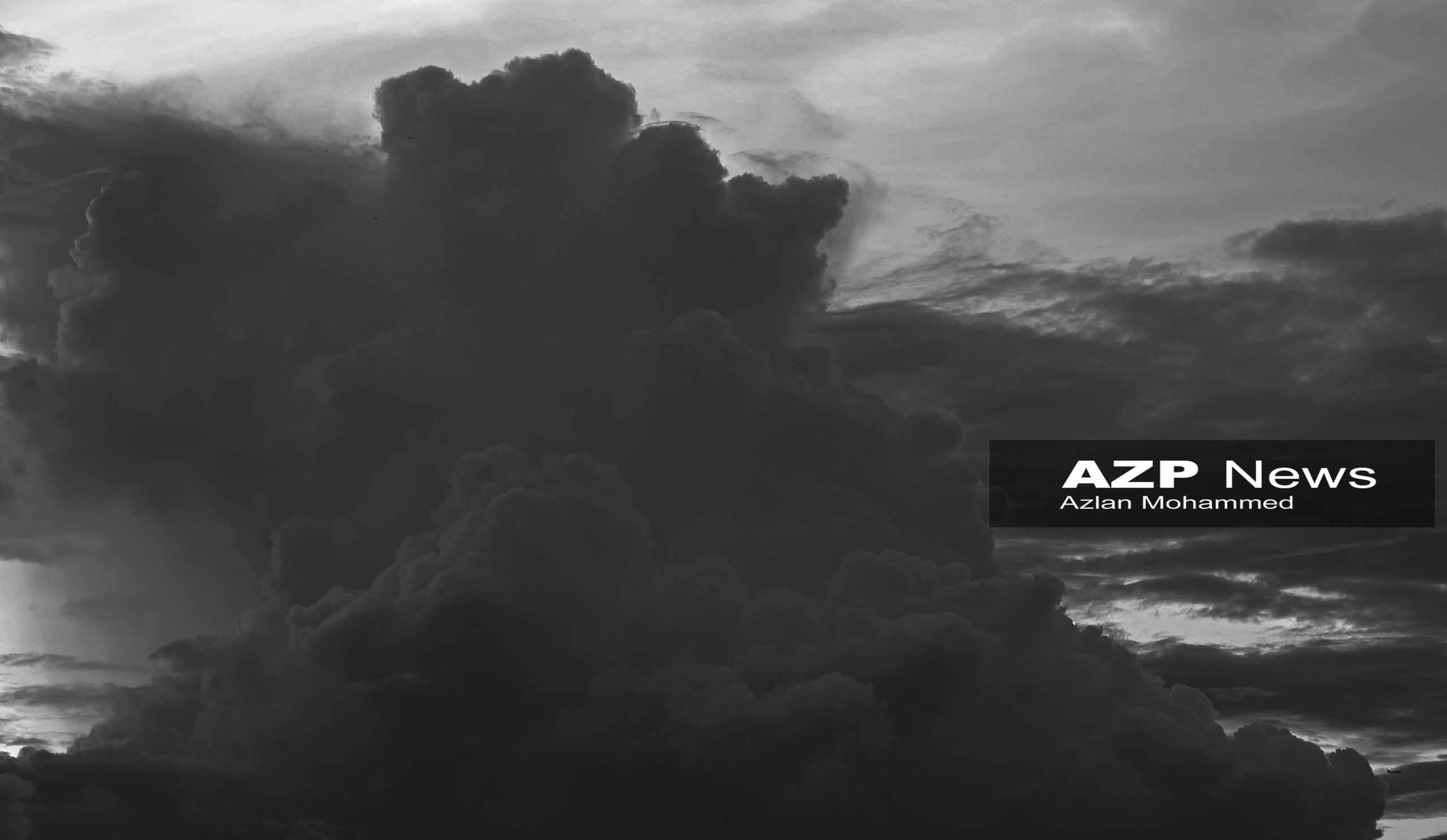 An American Airlines plane, bottom left, flies into Piarco International Airport covered by rain clouds