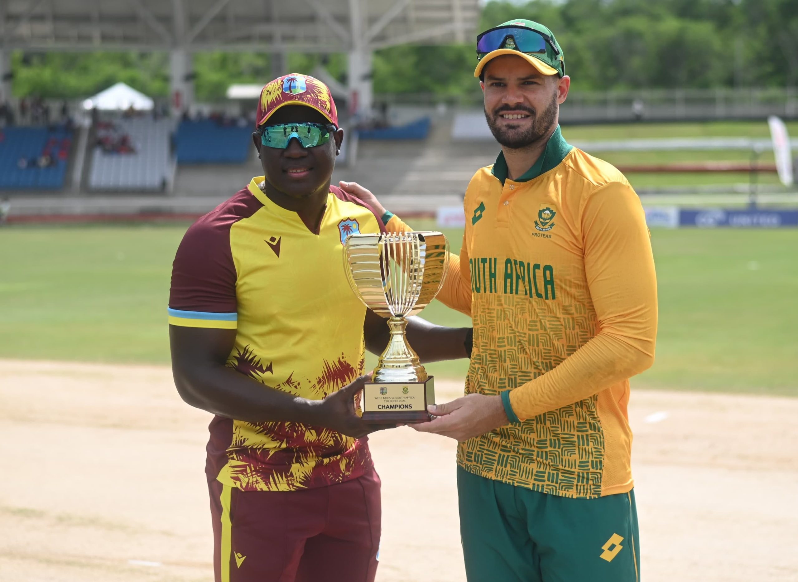 West Indies captain Rovman Powell and South African skipper Aiden Markram with the 2024 series T20I trophy