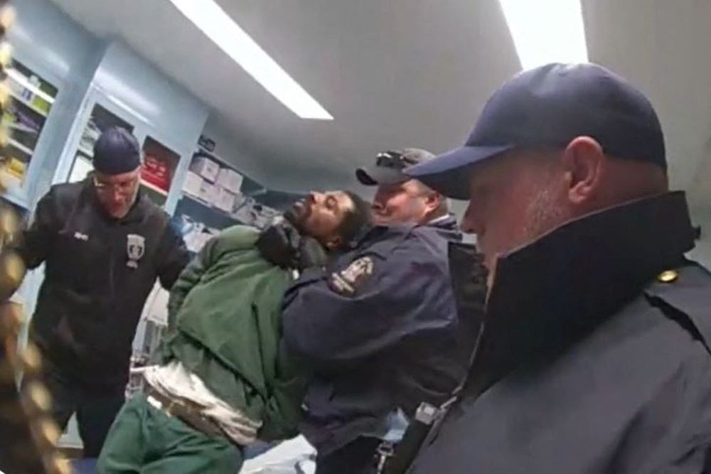 Caption: This screenshot taken from New York State Department of Corrections and Community Supervision (DOCCS) body camera footage and released by the Office of the New York State Attorney General shows DOCCS officers with Robert Brooks at Marcy Correctional Facility in Oneida County, New York on December 9. Credit: AFP Photo/New York State Department of Corrections