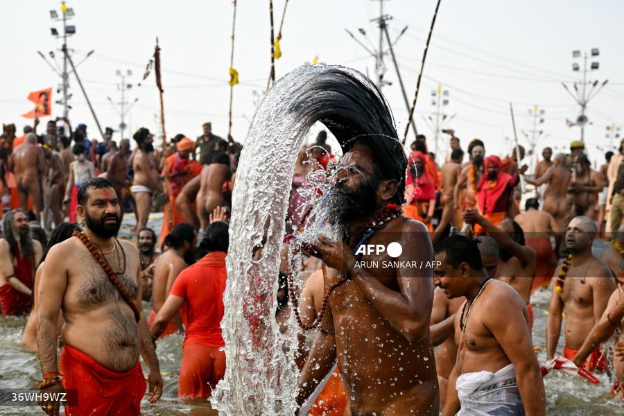 Naga Sadhus or Hindu holy men take a dip in Sangam, the confluence of Ganges, Yamuna and mythical Saraswati rivers, on an auspicious occasion of 'Mauni Amavasya' during the Maha Kumbh Mela festival in Prayagraj on January 29, 2025. AFP/Arun Sankar