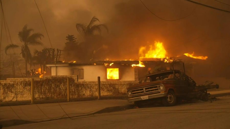 Wildfires engulf a house in Los Angeles. AFP Photo