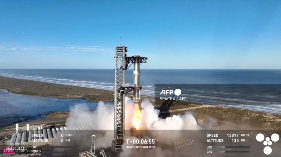 In this screen grab taken from the SpaceX broadcast the Starship's Super Heavy Booster is being grappled mid-air as it returns to the launch pad at Starbase near Boca Chica, Texas, on January 16, 2025. AFP Photo/Spacex /Handout