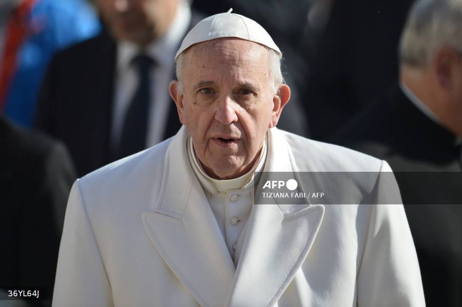 (FILES) Pope Francis looks on as he arrives for an audience to the Padre Pio Prayer Groups, on February 6, 2016 in Vatican. Pope Francis, who is hospitalised in critical condition with pneumonia in both lungs, "passed a tranquil night", the Vatican said on February 26, 2025. Pope Francis was admitted to Rome's Gemelli hospital on February 14 with breathing difficulties, but his condition worsened, with his bronchitis developing into double pneumonia. (Photo by TIZIANA FABI / AFP)