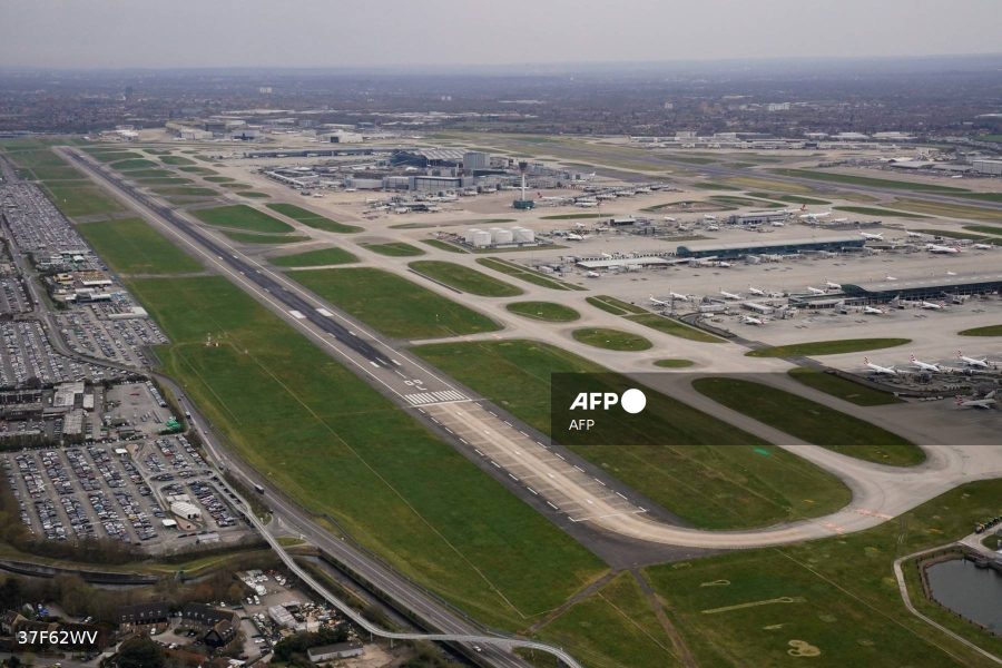 An aerial photograph taken on March 21, 2025 shows planes parked on the tarmac of Heathrow Airport following its closure after a fire broke out at a substation supplying power of the airport, in Hayes, west London. Britain's Heathrow airport, Europe's busiest, was shut down early on March 21 for 24 hours after a major fire at an electricity substation cut power to the sprawling facility west of London, officials said. (Photo by AFP)