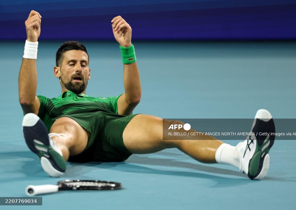 MIAMI GARDENS, FLORIDA - MARCH 30: Novak Djokovic of Serbia falls during the men's singles final against Jakub Mensik of the Czech Republic on the final day of the Miami Open Presented by Itau 2025 at Hard Rock Stadium on March 30, 2025 in Miami Gardens, Florida. Al Bello/Getty Images/AFP (Photo by AL BELLO / GETTY IMAGES NORTH AMERICA / Getty Images via AFP)