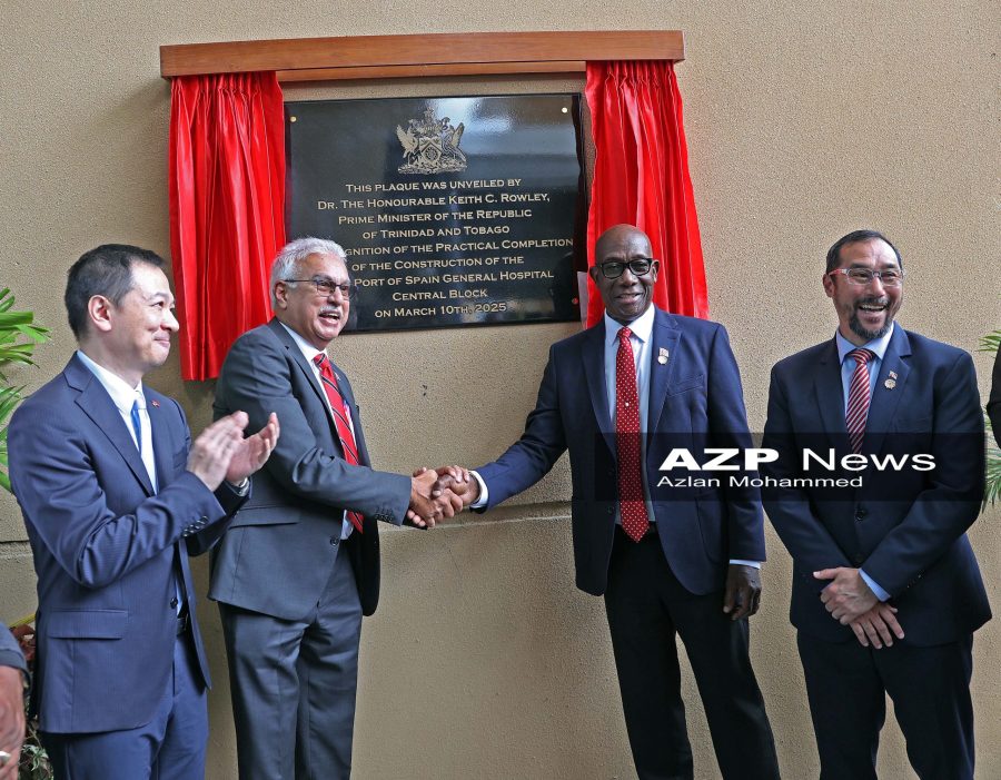 Prime Minister Dr Keith Rowley, second right, shakes the hand of Health Minister Terrence Deyalsingh, second left, as Charge d'Affaires of the Chinese Embassy Yang Han, left, and Minister of Energy Stuart Young look on