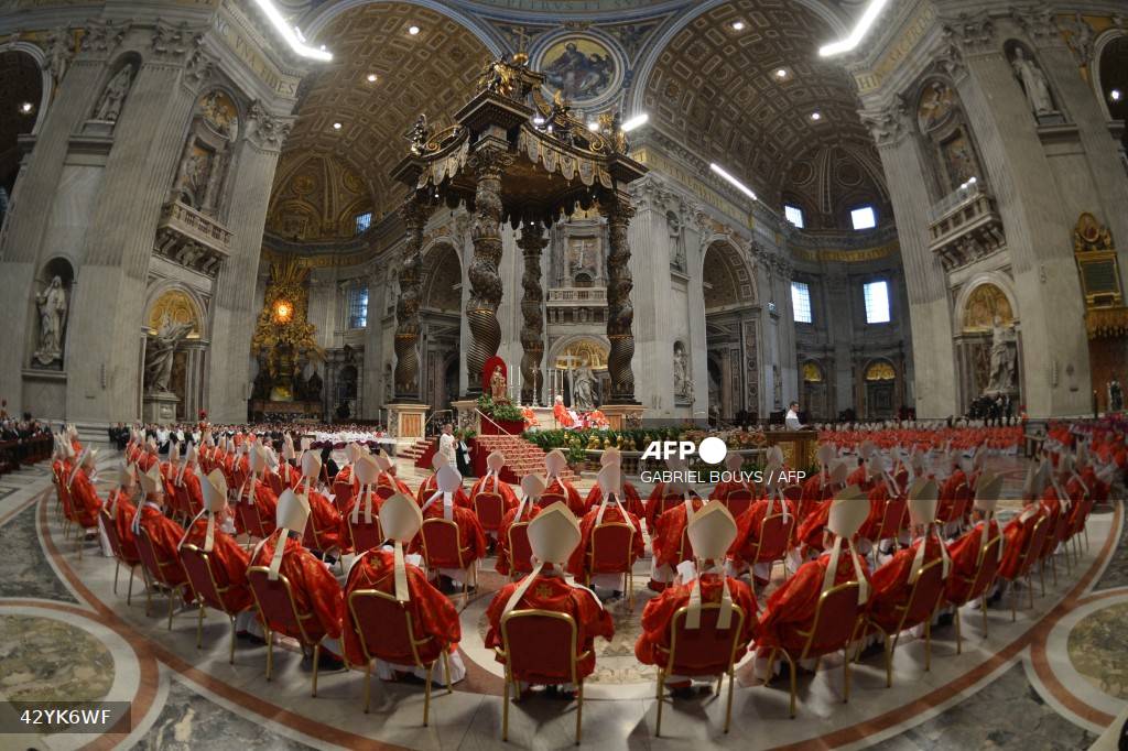 Caption: Cardinals attend a mass at the St Peter's basilica before the start of the conclave on March 12, 2013 at the Vatican. The death of Pope Francis on April 21, 2025 sets in motion centuries-old traditions which will culminate in the election by cardinals of a new pontiff. Under a system originating in the 13th century, the conclave sees cardinals aged under 80 meet in private to choose the next pope from among their peers. They are sworn to absolute secrecy, under pain of ex-communication, during the voting. AFP/Gabriel Bouys