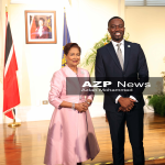 Prime Minister Kamla Persad-Bissessar with THA Chief Secretary Farley Augustine