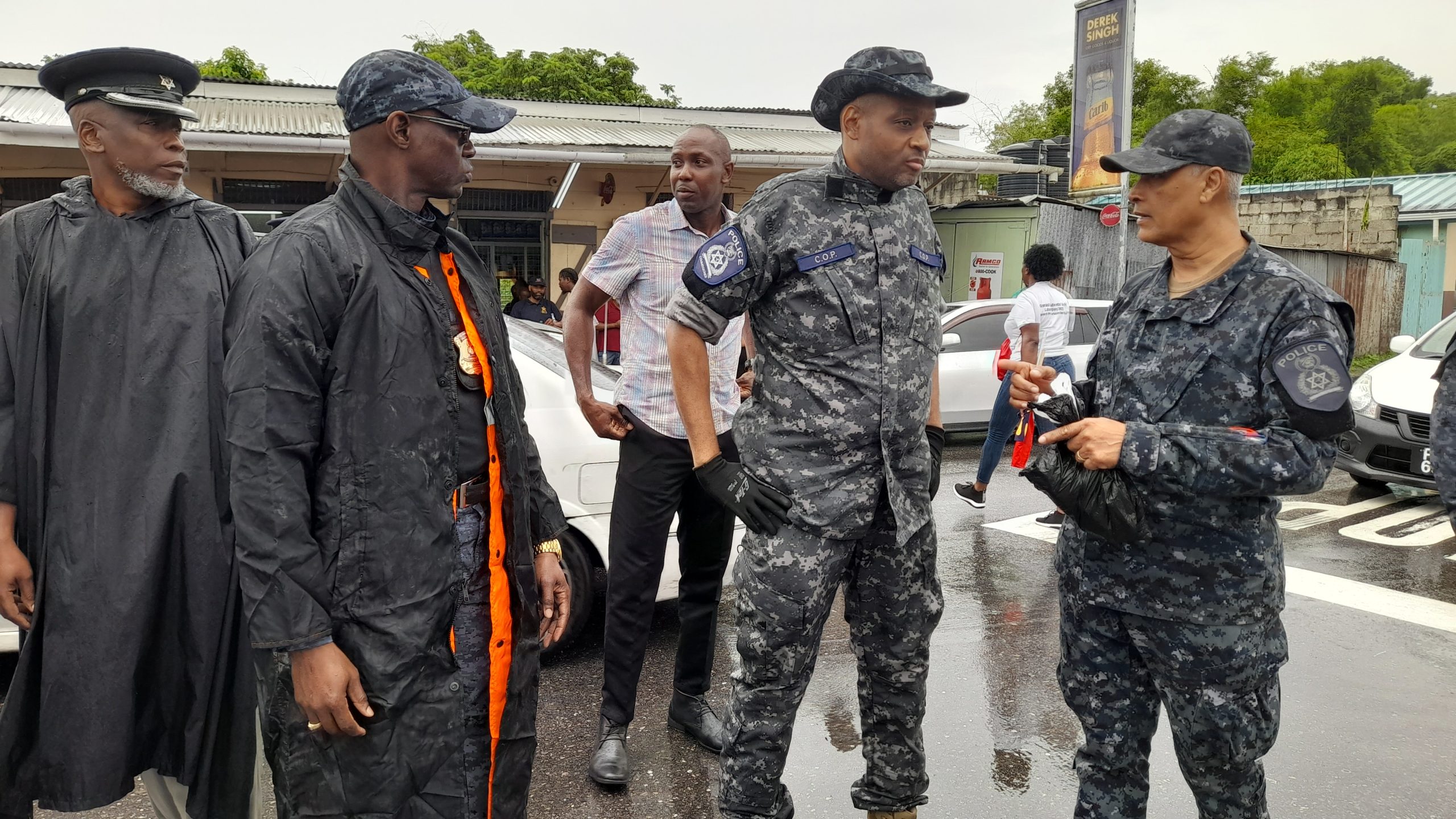 Police Commissioner Allister Guevarro with Deputy Police Commissioner Junior Benjamin, left, in Fyzabad on Thursday. AZP News/Sue-Ann Wayow