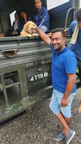 Caption: Chairman of the Couva/Tabaquite/Talparo Regional Corporation Ryan Rampersad with recused dog Bella