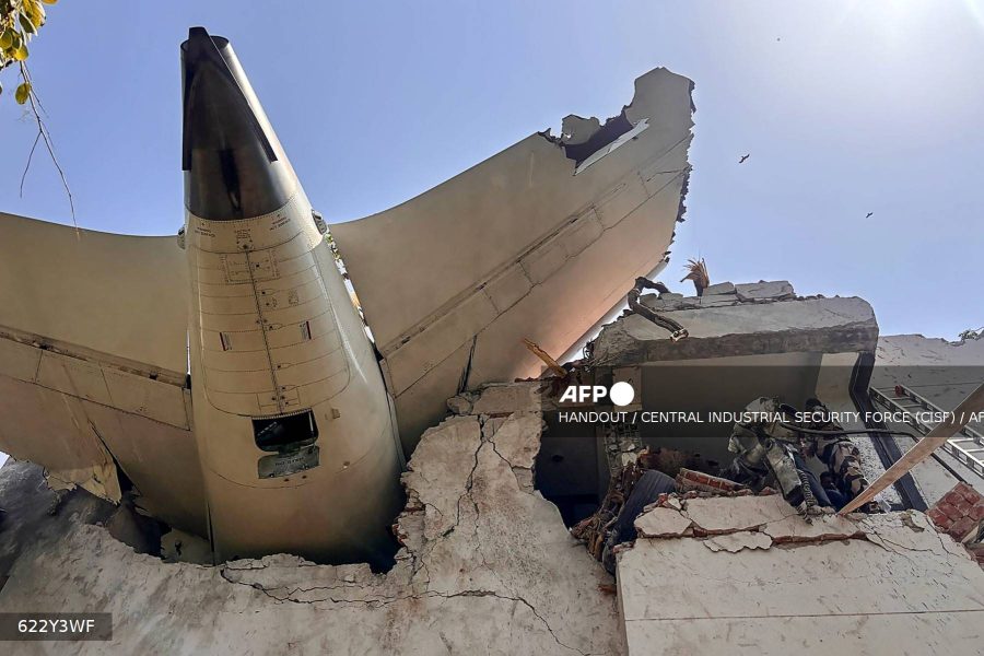 Caption: This handout taken and posted on the X (formerly Twitter) account of the Central Industrial Security Force (CISF) on June 12, 2025 shows the back of an Air India plane after it crashed in a residential area near the airport in Ahmedabad. Photo by Handout/Central Industrial Security Force/AFP