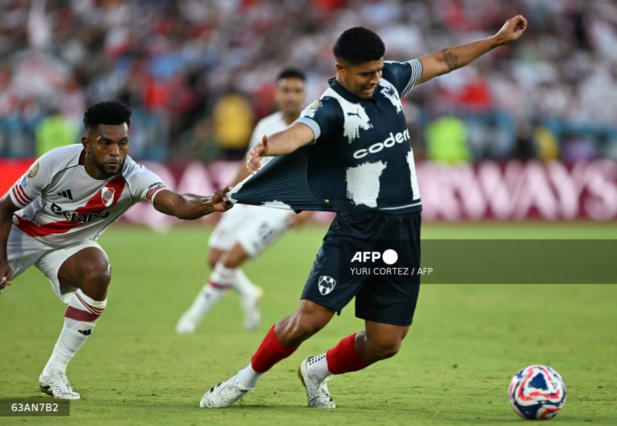 Caption: River Plate's Colombian forward #09 Miguel Borja grabs the jersey of Monterrey's Mexican defender #04 Victor Guzman during the FIFA Club World Cup 2025 Group E football match between Argentina's River Plate and Mexico's Monterrey at the Rose Bowl stadium in Los Angeles on Saturday