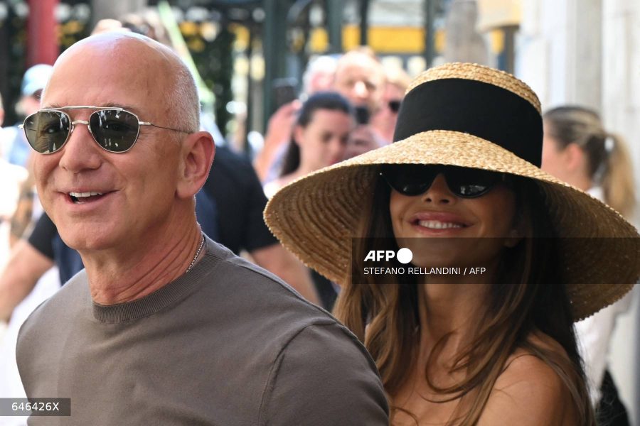 Caption: Amazon's founder Jeff Bezos and his wife Lauren Sanchez Bezos arrive at the Harry's Bar restaurant a day after their wedding in Venice on June 28, 2025