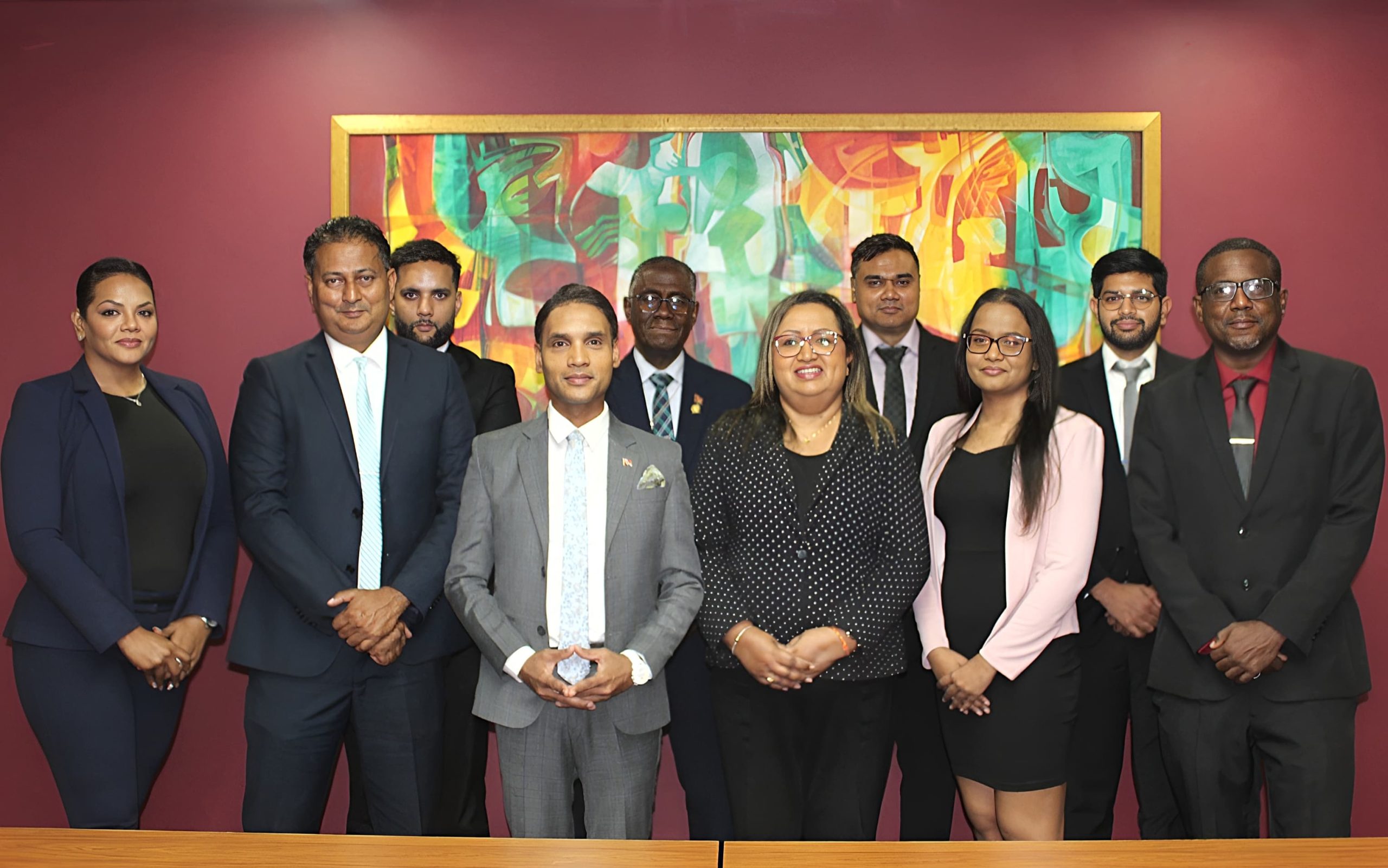 Caption: Back row, front left, Roshan Tota Maharaj, Raymond Cozier, Curtis Boodoo and Kevin Gurbani Beepath. Front row, from left, Taramatie Mongroo, Chairman Anil Kamal, Minister of Public Utilities Barry Shiva Padarath, Ravita Babwahh, Dana Mahase and Gerrard Small