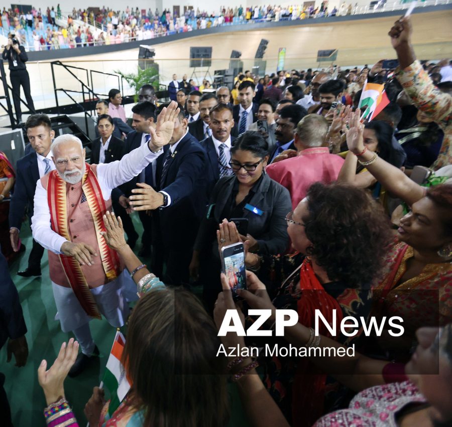 India Prime Minister waves to the audience at the National Cycling Velodrome in Couva on Thursday