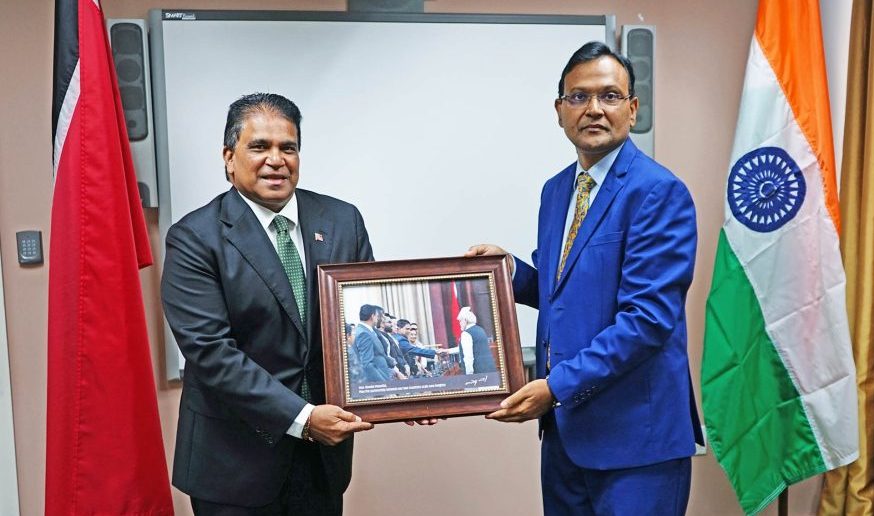 Caption: India's High Commissioner Dr Pradeep Singh Rajpurohit, right, and Minister of Energy Dr Roodal Moonilal 