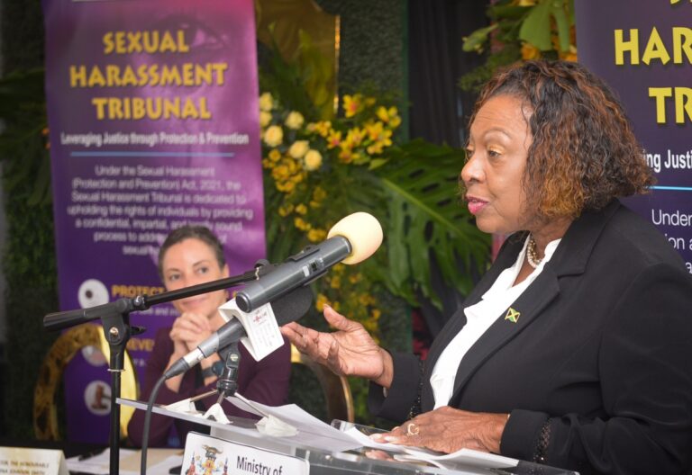Minister of Culture, Gender, Entertainment and Sport Olivia Grange addressing the swearing-in ceremony for the Sexual Harassment Tribunal. Looking on is Minister of Foreign Affairs Senator Kamina Johnson Smith. Photo: CMC