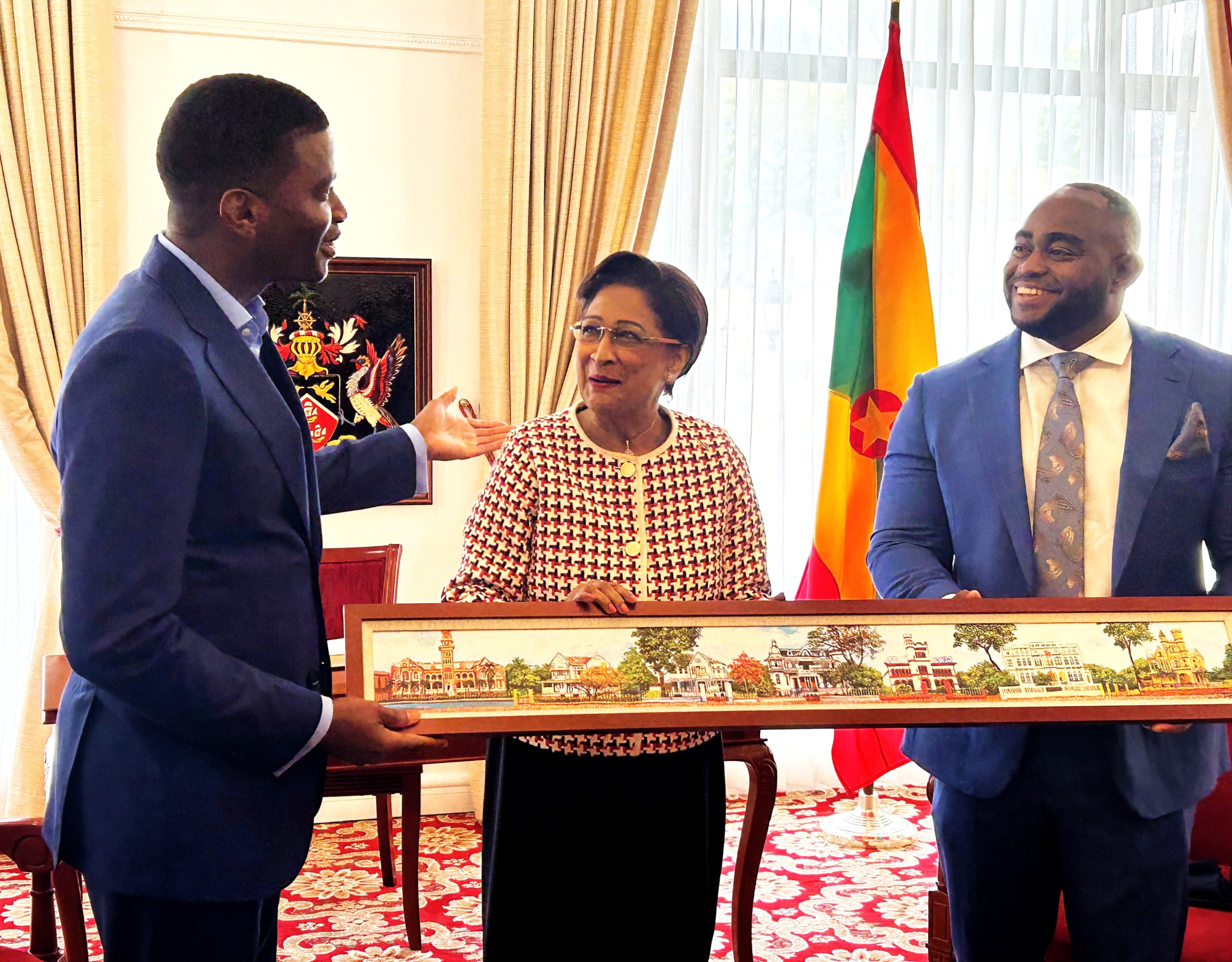 Caption: Prime Minister of Grenada Dickon Mitchell accepts a painting of the Magnificent Seven from Prime Minister Kamla Persad-Bissessar and Minister of Foreign Affairs and CARICOM Sean Sober after their meeting on Friday at the Diplomatic Centre, St Ann's. AZP News/Alicia Chamely