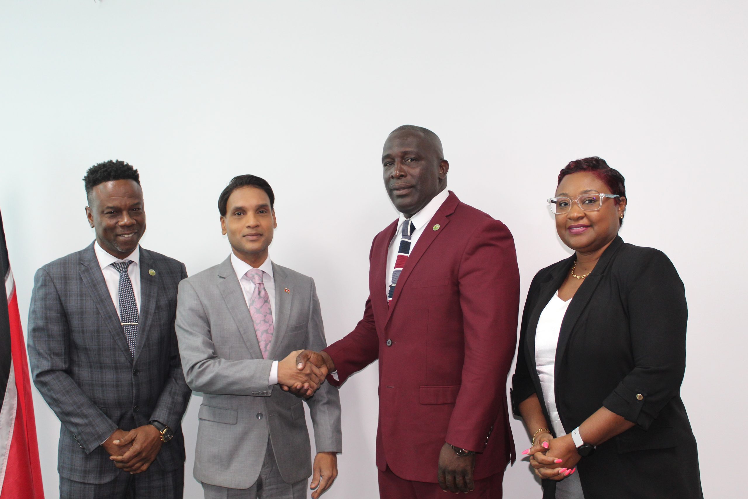 Caption: Minister of Public Utilities Barry Padarath shakes hands with Tobago House of Assembly’s (THA) Division of Settlements, Public Utilities and Rural Development Secretary Ian Pollard during a meeting this week to discuss issues faced by Tobagonians in accessing public utilities. They are joined by other members of the THA.  Photo: Ministry of Public Utilities