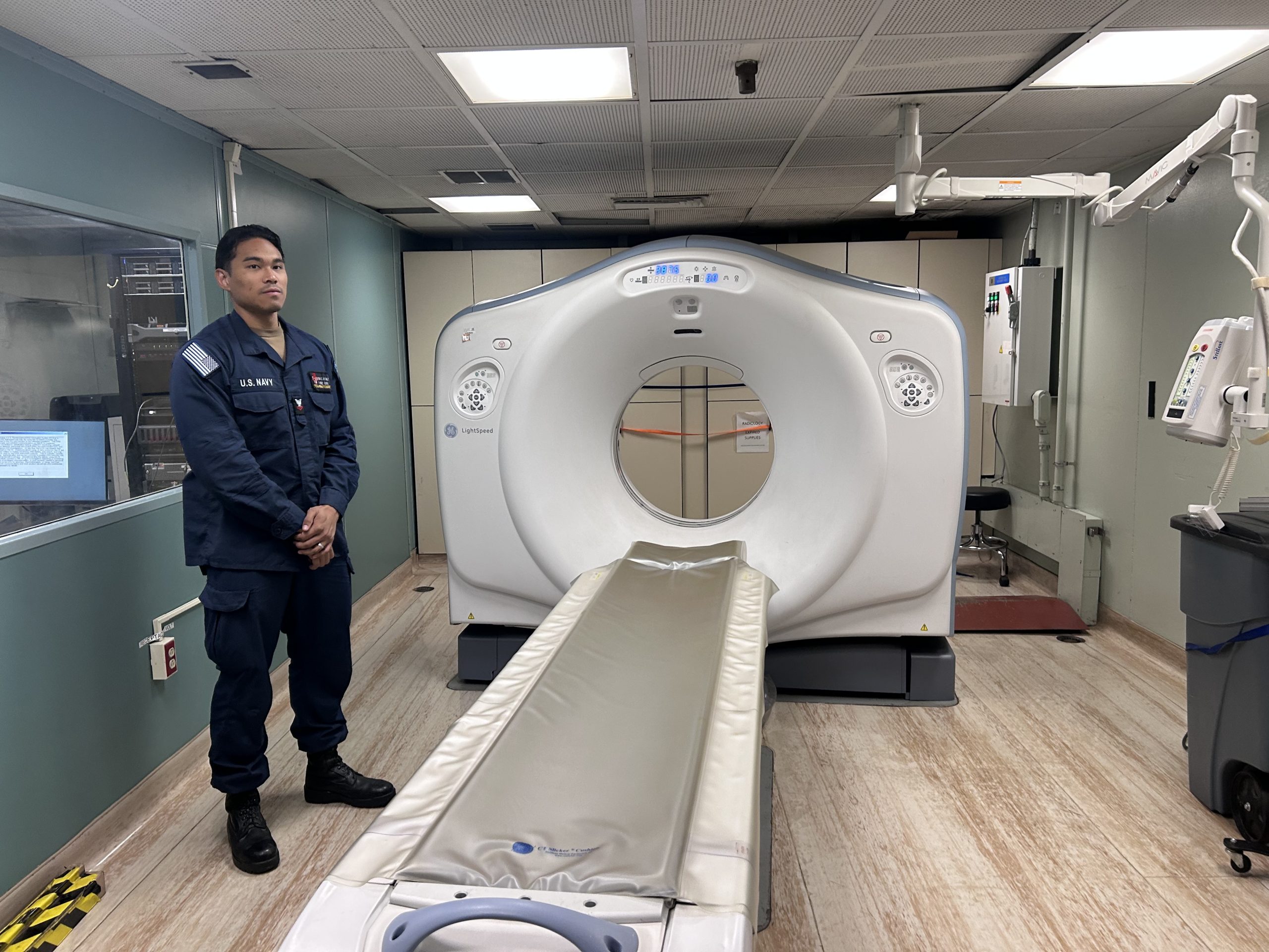 HM2 John Macatuno showed the media the high-speed CAT SCAN machine on the USNS Comfort. AZP News/Alicia Chamely