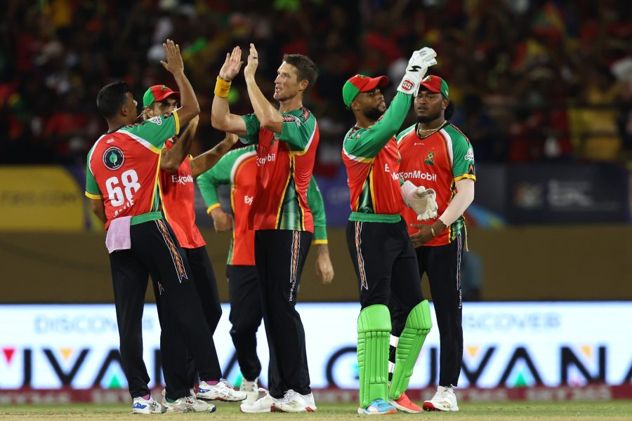 Dwaine Pretorius of Guyana Amazon Warriors celebrates with teammates after getting the wicket of Kadeem Alleyne of Barbados Royals. Photo: CPL via Getty Image
