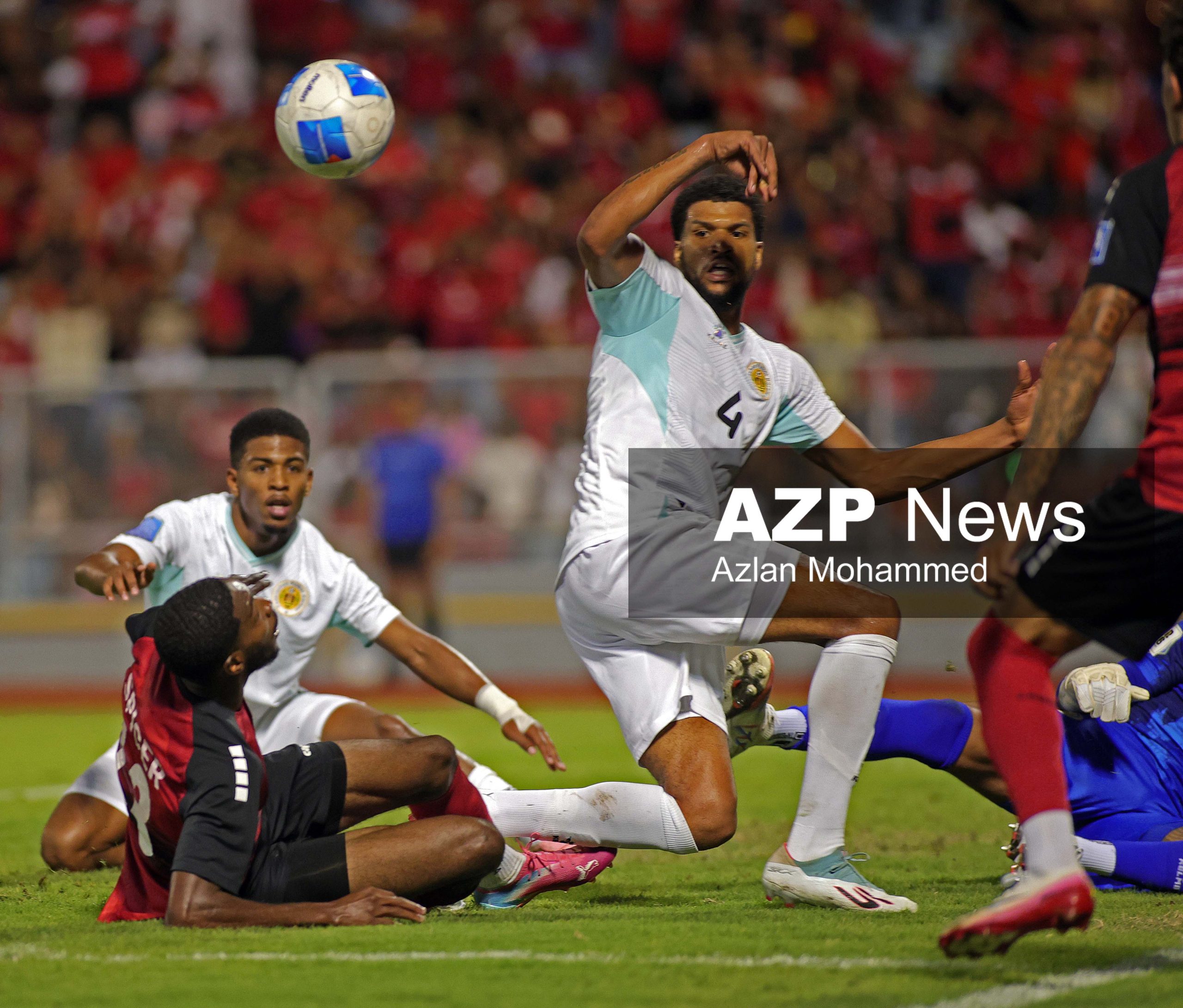 T&T midfielder Tyrese Spicer (13) gets a heavy challenge Shurandy Sambo (2) Jeremy Antonisse (11)