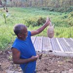Caption: Holding a tattoo/armadillo at a camp in Navet on the last hunting day on Saturday